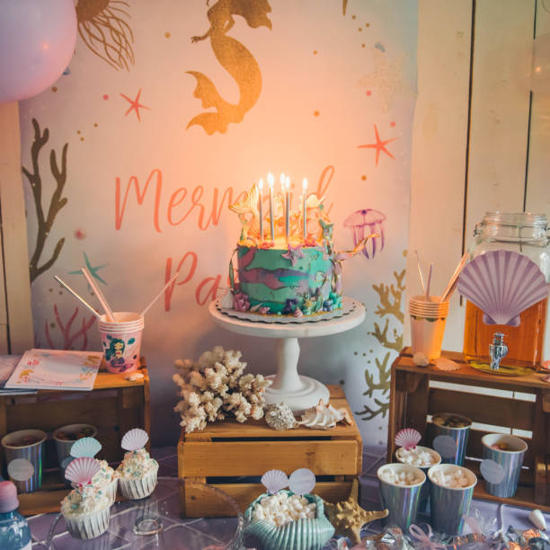 istock Lighting candles on birthday cake. 1193351748