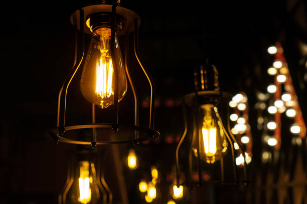 istock Minimalistic lamps in loft style. Yellow light. 1193354761
