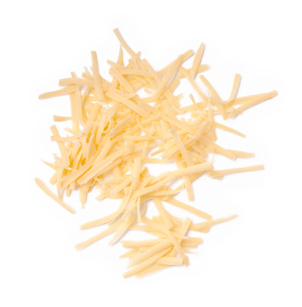 Grated cheese isolated on white background. Slices cheese. Top view.