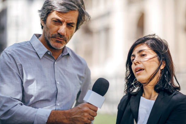 istock Television reporter interview on the street 1193356313