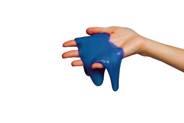 istock Blue slime in hand, isolated on white. 1193356589
