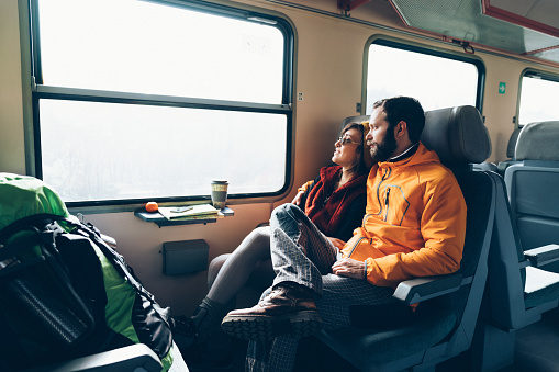 Couple traveling in train