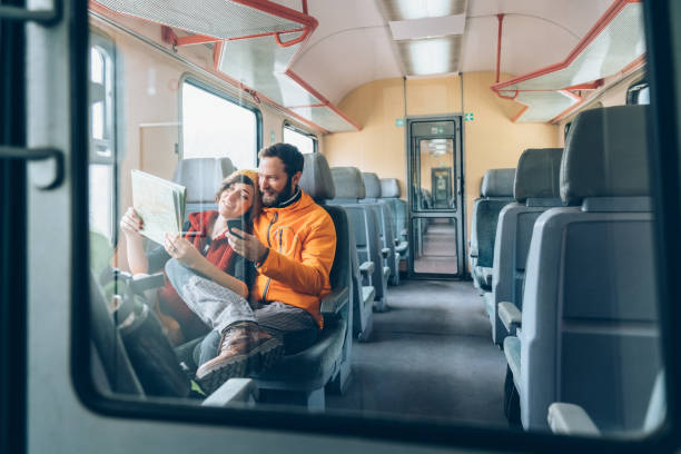 istock Couple reading map in the train 1193361627