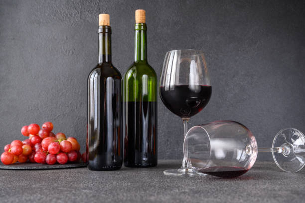 istock Red wine with bunch of grapes 1193365897