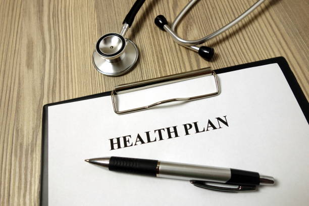 istock Health plan paper with pen and stethoscope 1193366022