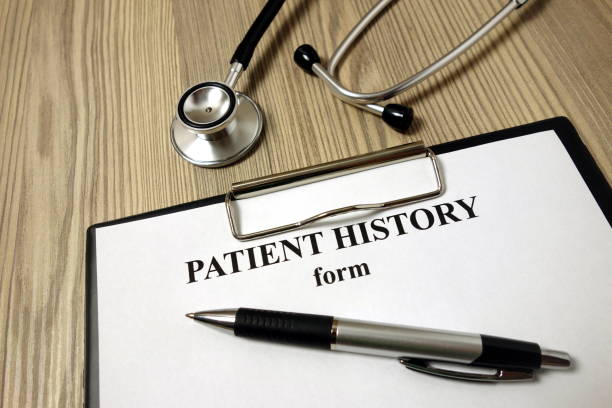istock Patient history form with pen and stethoscope 1193366579