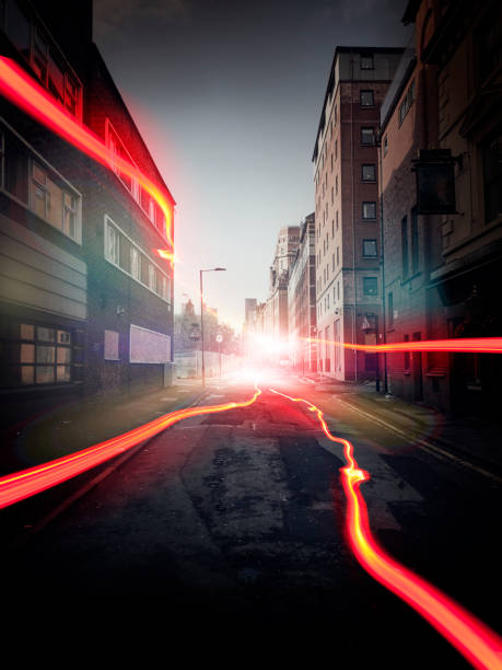 Red light trail - light paint - to represent the 5G cell phone network is spreading in the city at light speed. The image is dark and the new network is clearly visible