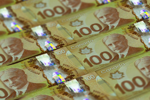 CAD. Canadian currency background. Closeup photo. Toronto CAD. Canadian currency background. Closeup photo. Dollars of Canada canadian currency photos stock pictures, royalty-free photos & images