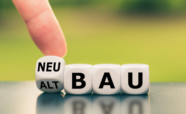 istock Hand turns a dice and changes the German word 