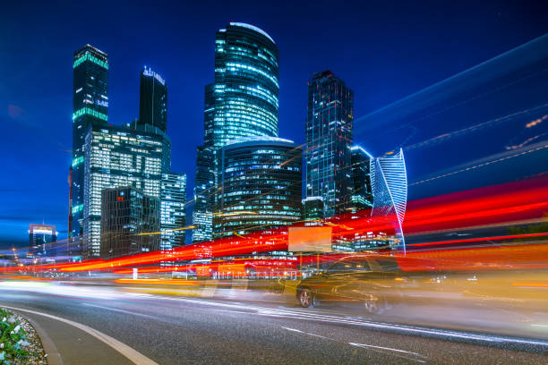 istock Modern office buildings with light trails 1193370724
