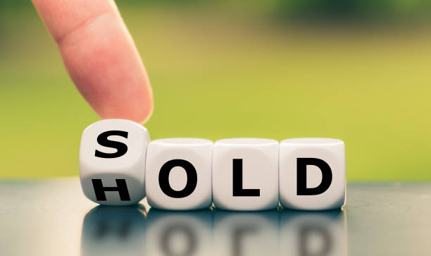 istock Hand turns a dice and changes the word 