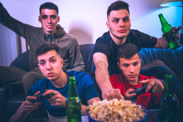 istock Group of male friends playing games 1193373821