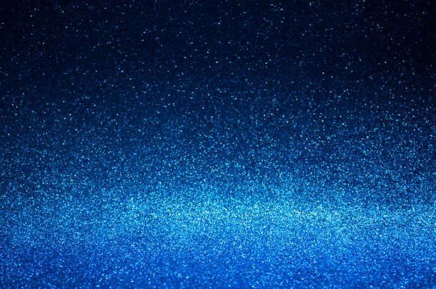 istock Navy blue abstract light background,dark blue bokeh shining lights,sparkling glittering Christmas lights.Season greeting background.New year Luxury backdrop image.Blurred abstract holiday background. 1193375060