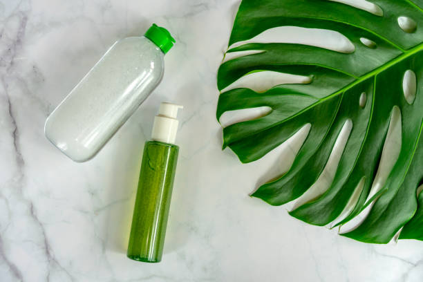 istock bio natural cosmetic products next to leaf with marble background . 1193375349