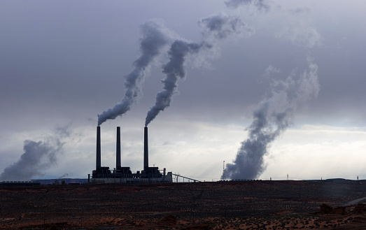 Lots of smoking chimneys in a dark environment