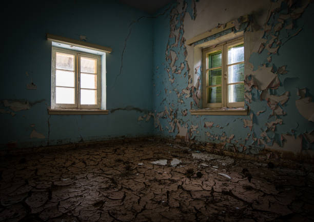 istock Interior of a dirty abandoned  room with dry cracked mud 1193377894