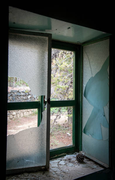 istock Open broken window of an abandoned room 1193377932