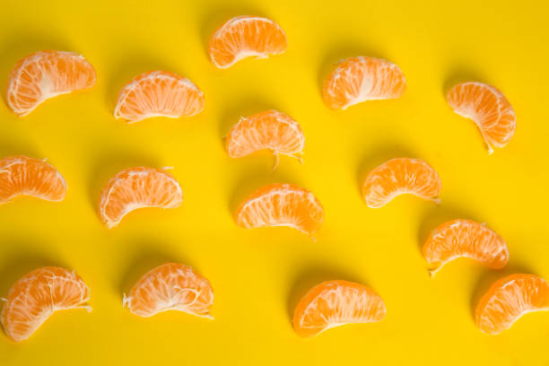 istock Mandarin isolated on yellow background 1193378719