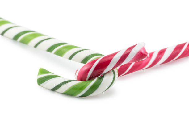 рождественские конфеты - stick of hard candy candy striped toughness стоковые фото и изображения