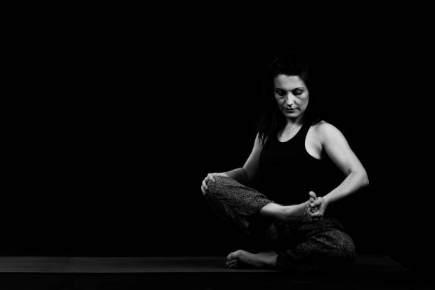 istock Yoga on black background 1193384899