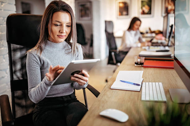 istock Business women working on digital tablet 1193385050