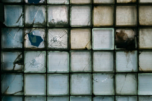 istock Surface of dirty broken glass block window 1193386909