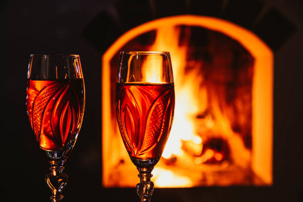 istock delicious red wine at romantic fireplace. Romantic concept. 1193387111