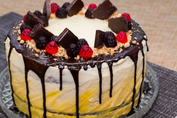 istock Sweet cake with chocolate icing and marmalade on a brown background 1193388121