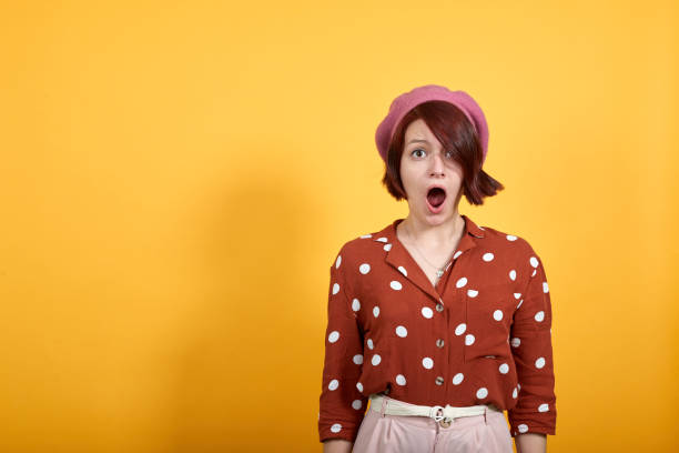 istock Attractive woman looking scared and surprised cheering expressing wow gesture 1193388192