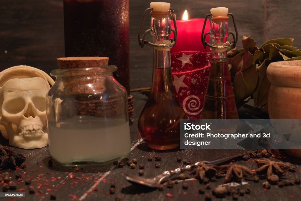 potion of natural herbs for black magic potion of natural herbs for black magic with mortar and skull Alchemy Stock Photo