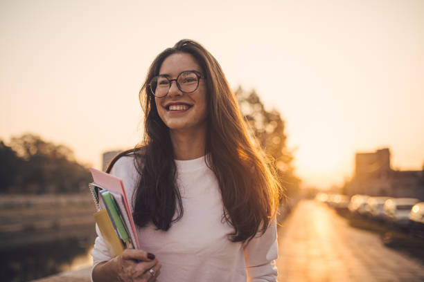 Female student walking around her town after her lectures