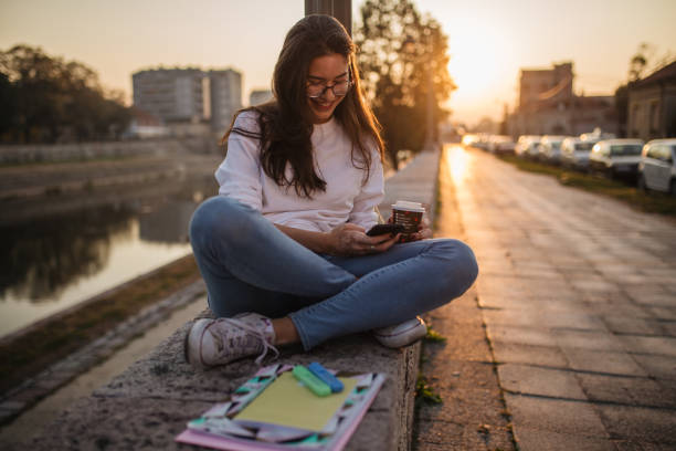 istock Girl texting her friends 1193394682