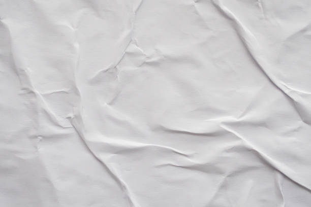 istock Blank white crumpled and creased paper poster texture background 1193399406