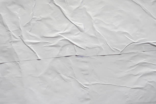 Blank white crumpled and creased paper poster texture background