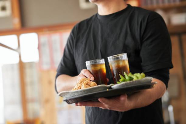 Job image of a man working in a pub Job image of a man in his 30s working at a Japanese restaurant byte photos stock pictures, royalty-free photos & images