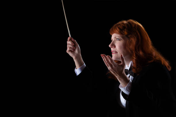 istock Woman in tuxedo conducting 1193407215