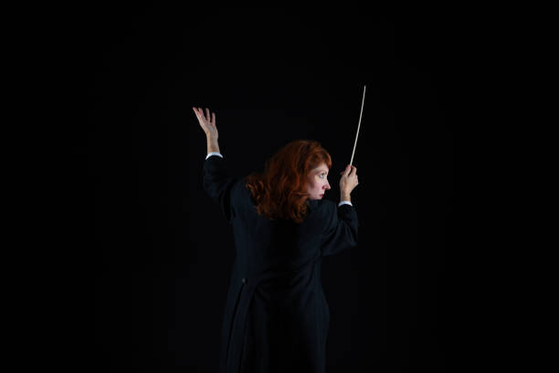 istock Woman in tuxedo conducting 1193407280