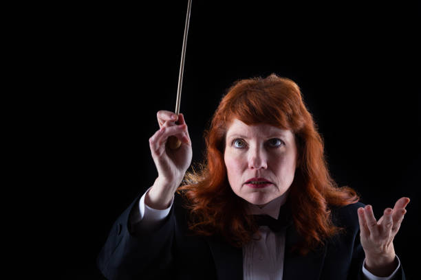 istock Woman in tuxedo conducting 1193407302