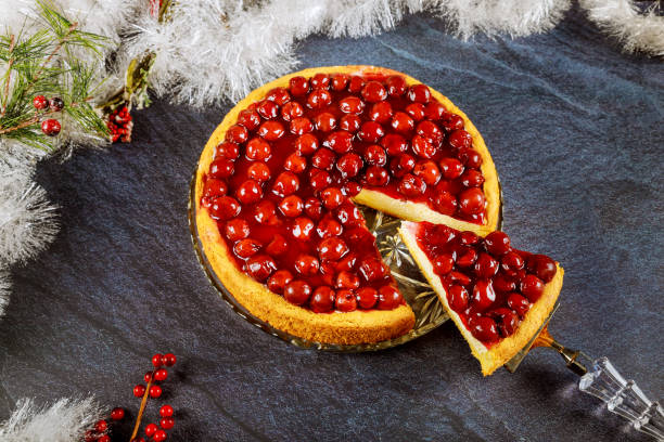 istock Cherry cheesecake with cherry jelly on the top with Christmas decotation. 1193409494