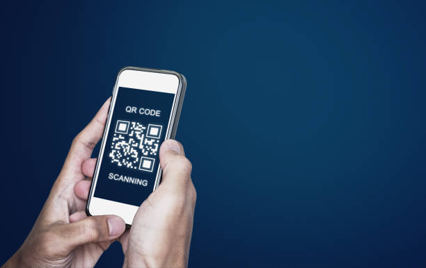 QR code scanning payment and verification. Hand using mobile smart phone scan QR code stock photo