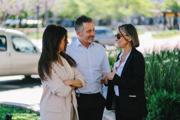istock Friends talking on street after work 1193413428