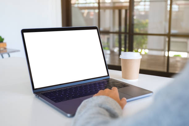 istock a woman using and touching on laptop touchpad with blank white desktop screen 1193415829
