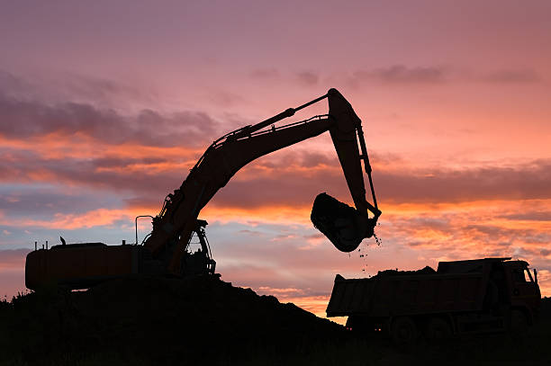 istock excavator and dumper truck 119341738
