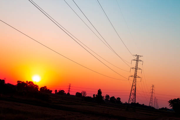 istock High voltage power transmission line On the beautiful sunset sky background 1193420692