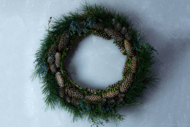 istock Christmas decorative green wreath with fresh blueberries and natural herbs 1193425849