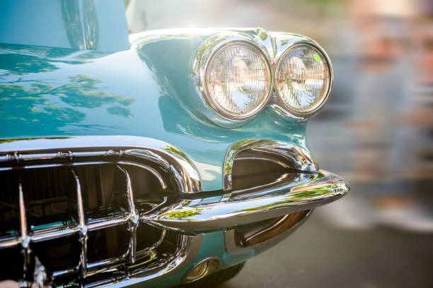 old turquoise vintage retro car with double round headlights standing at an exhibition on a street of a provincial town in the sunlight - collectors car antiquities ancient past imagens e fotografias de stock