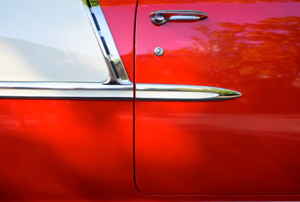 side of a bright red vintage retro convertible car with chrome details and moldingsю - collectors car antiquities ancient past imagens e fotografias de stock