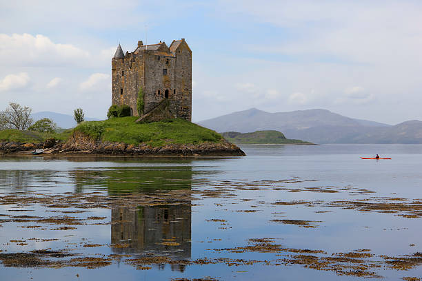 istock kayak explores castle stalker scotland highlands 119342885