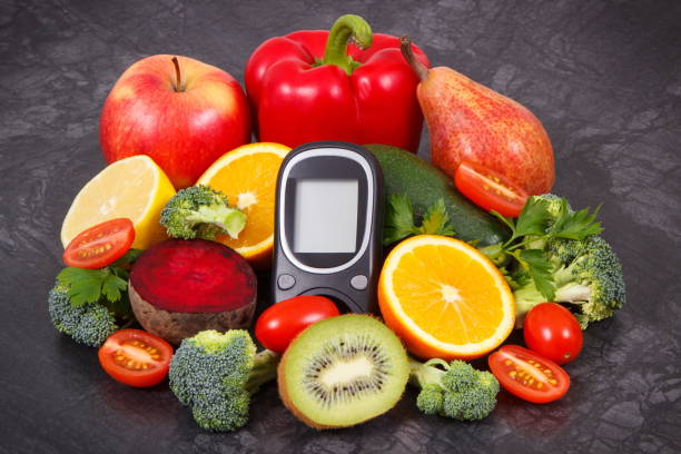 istock Glucose meter for checking sugar level and fruits with vegetables, nutritious dessert containing minerals and vitamins for diabetic 1193429276
