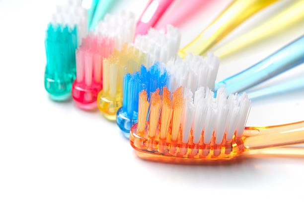 szczoteczki do zębów - toothbrush dental hygiene dental equipment rainbow zdjęcia i obrazy z banku zdjęć